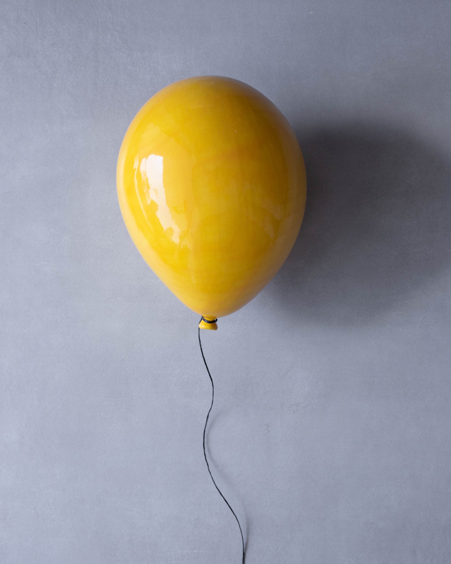 Yellow Glossy Ceramic Balloon Sculpture