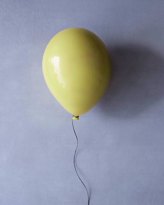 Light Yellow Glossy Ceramic Balloon Sculpture